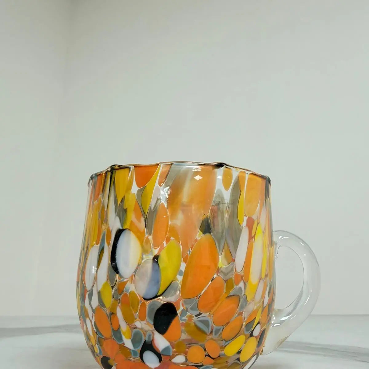 Multifarvet orange cappuccino-kop i Murano-glas